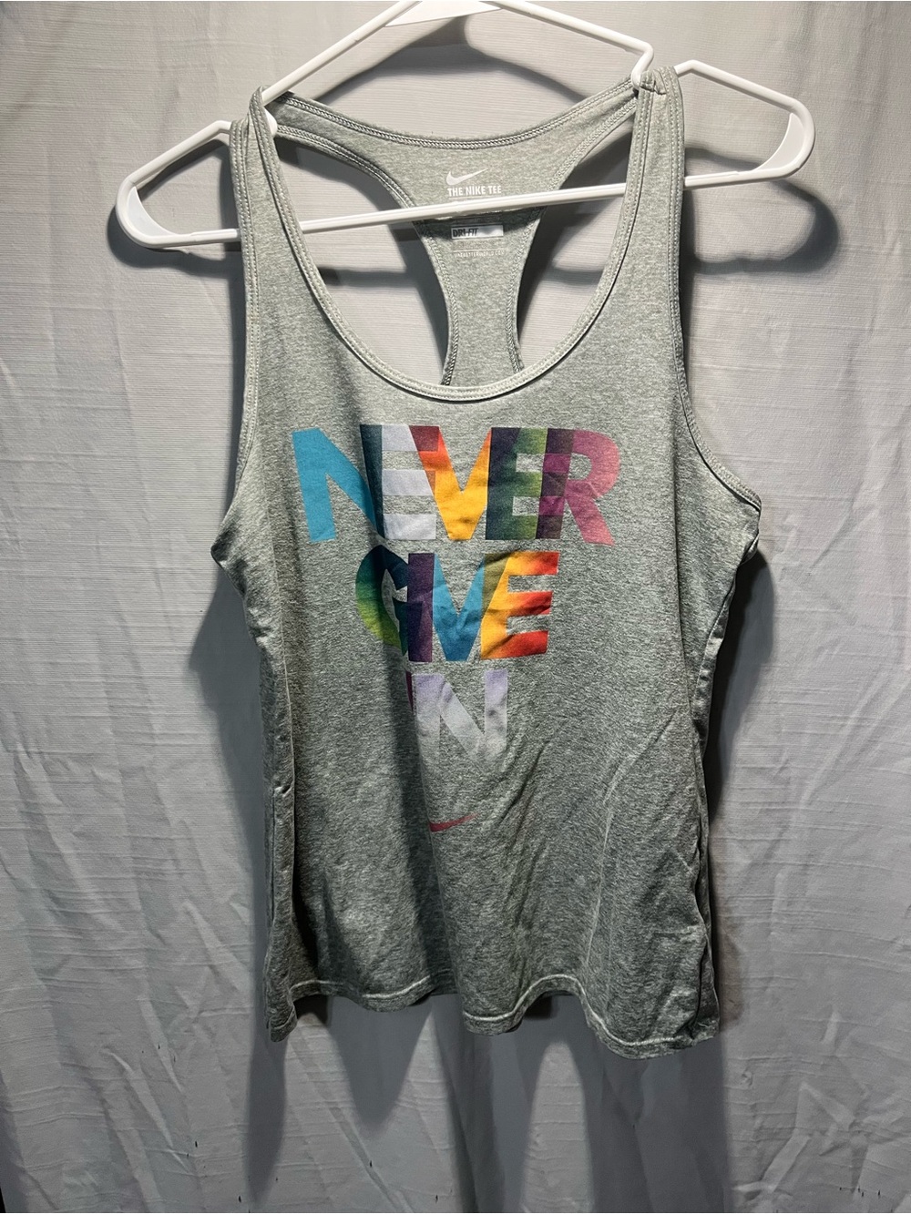 Nike Women’s Light Gray Racerback Tank with Colorful "NEVER GIVE IN" Graphic